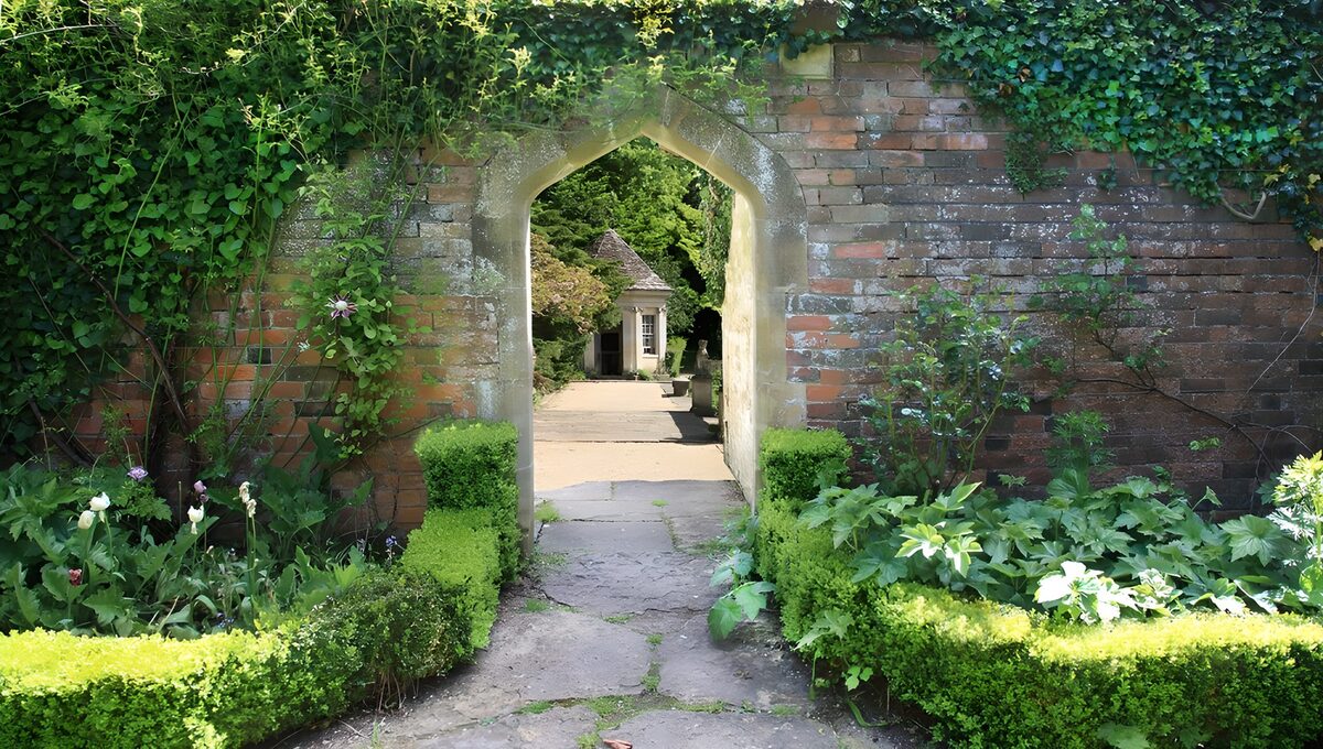 Stone arch and path in a walled garden