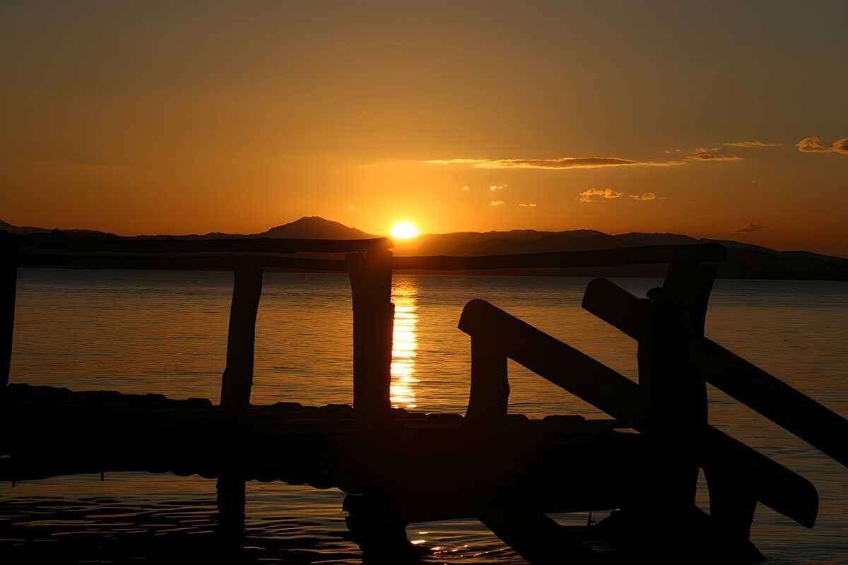 Sunset behind a wooden pier