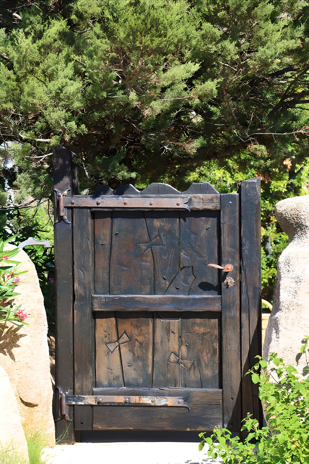 A wooden gate where the shadows gather
