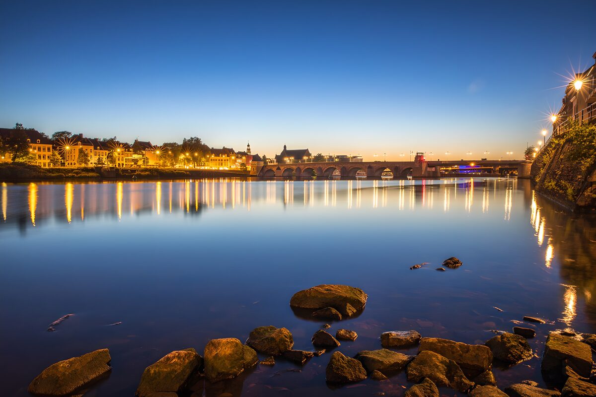 Stone bridge over a river at dusk