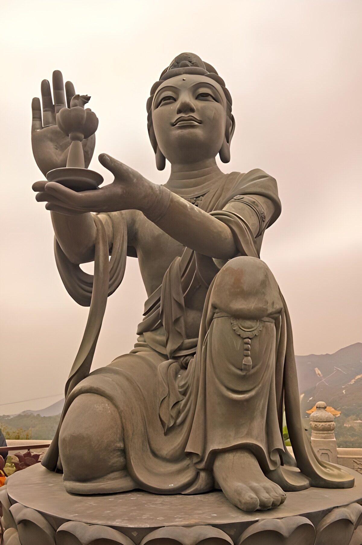 Stone Buddhist statue in soft mountain light