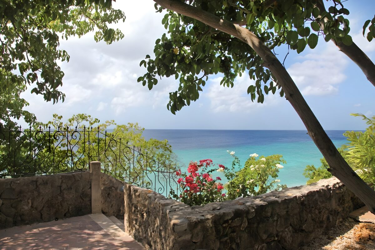 Shaded terrace overlooking turquoise water