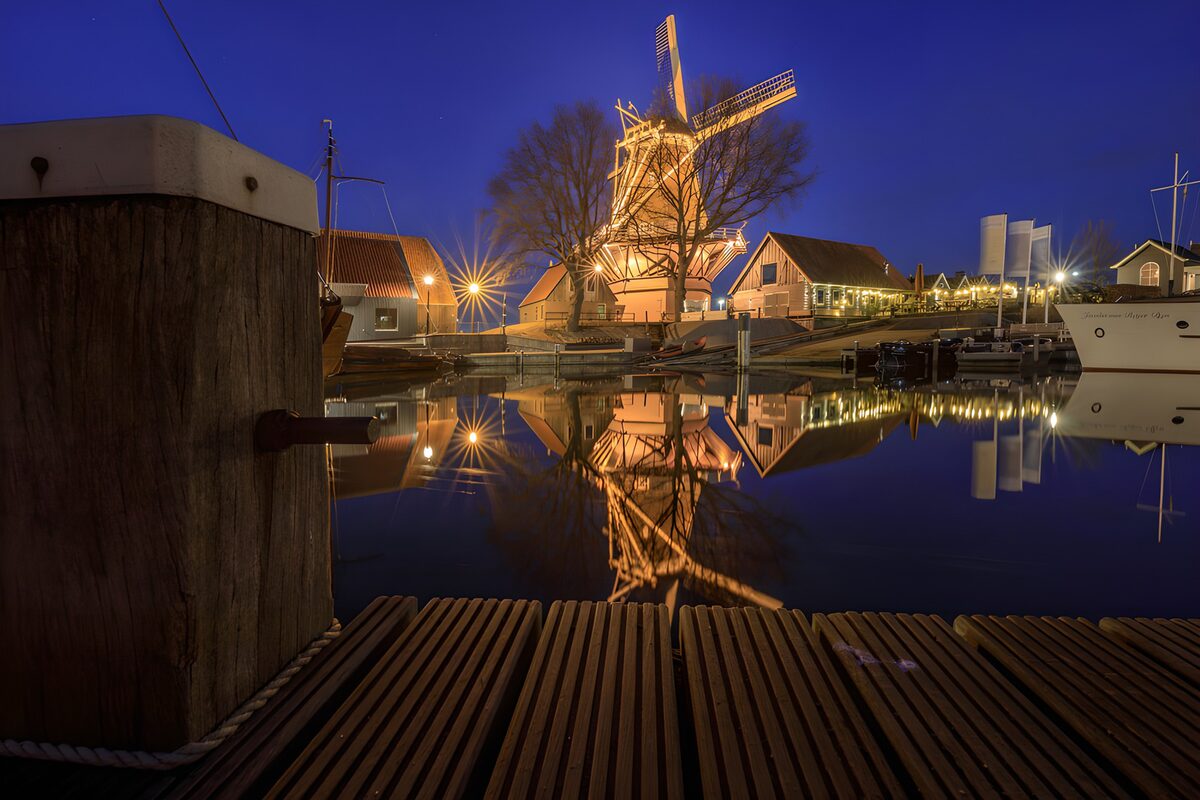 Windmill by the harbour after dark