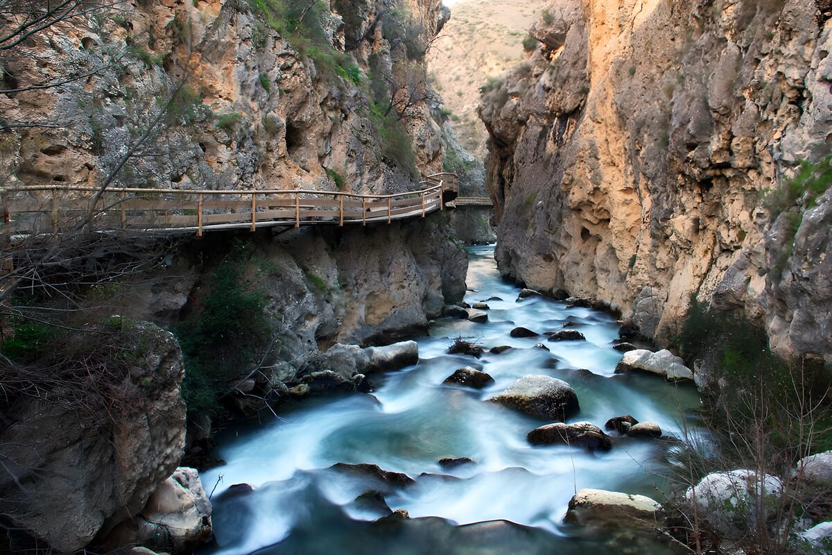 Blue-green stream through a rocky gorge