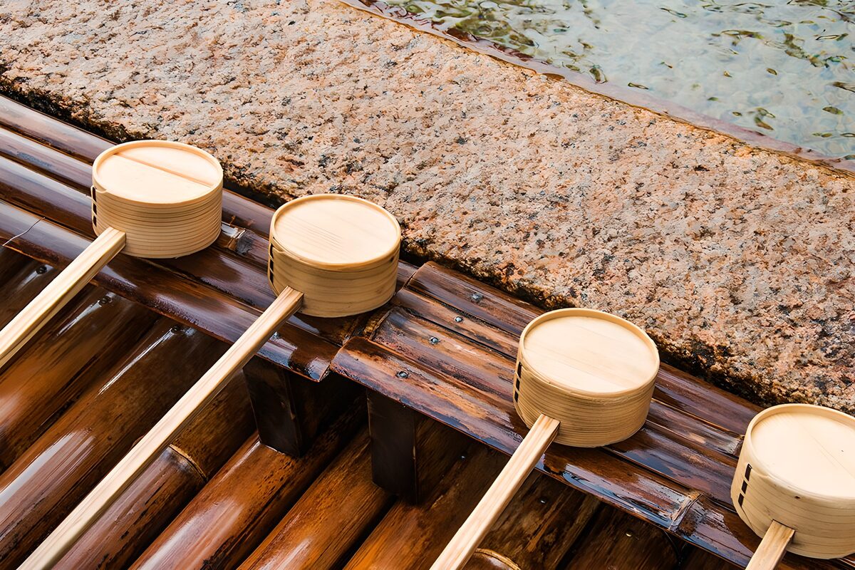 Four wooden ladles at rest on bamboo