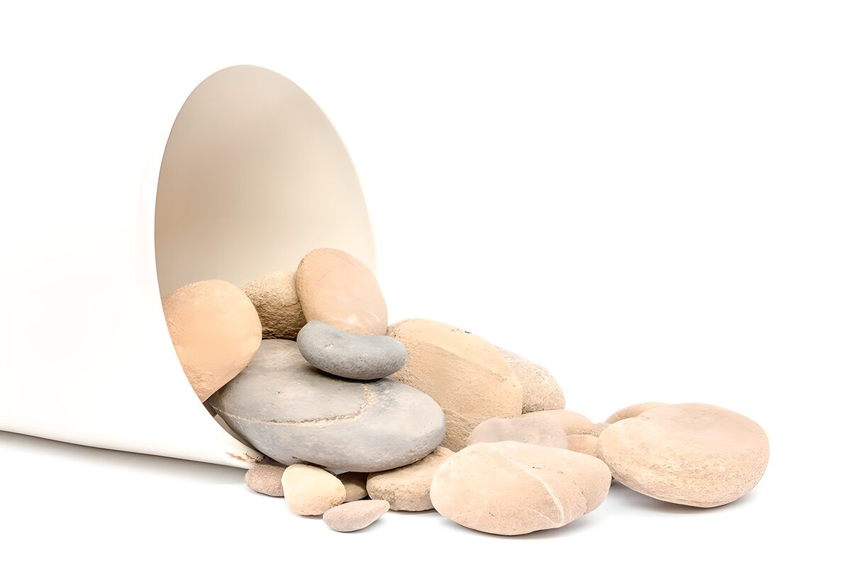 Pale pebbles and a quiet grey stack