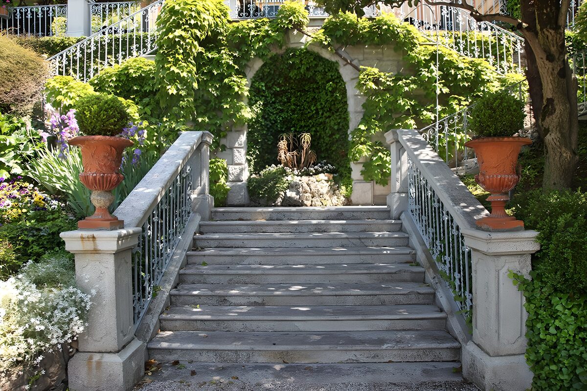 Sun-dappled steps and white railings
