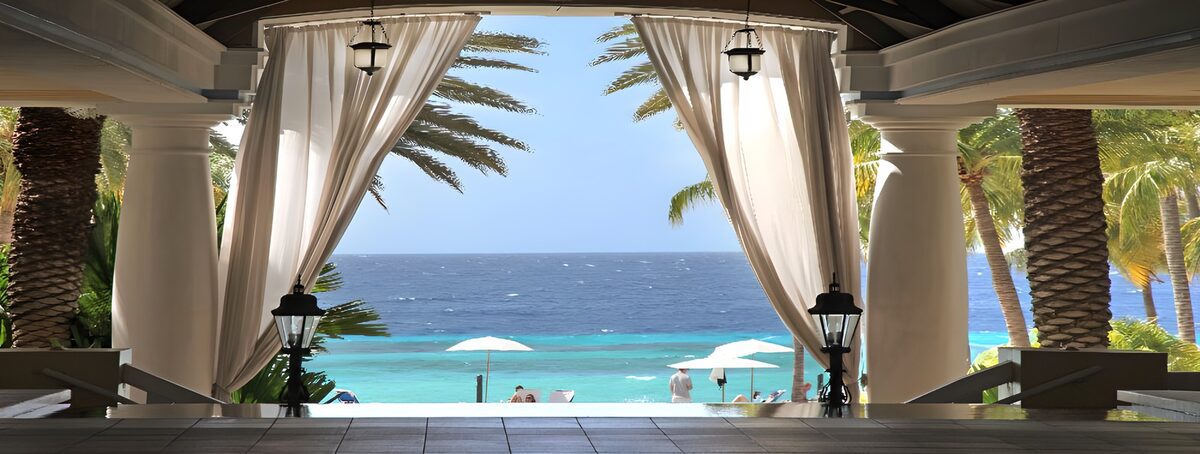 Shaded terrace overlooking a turquoise sea