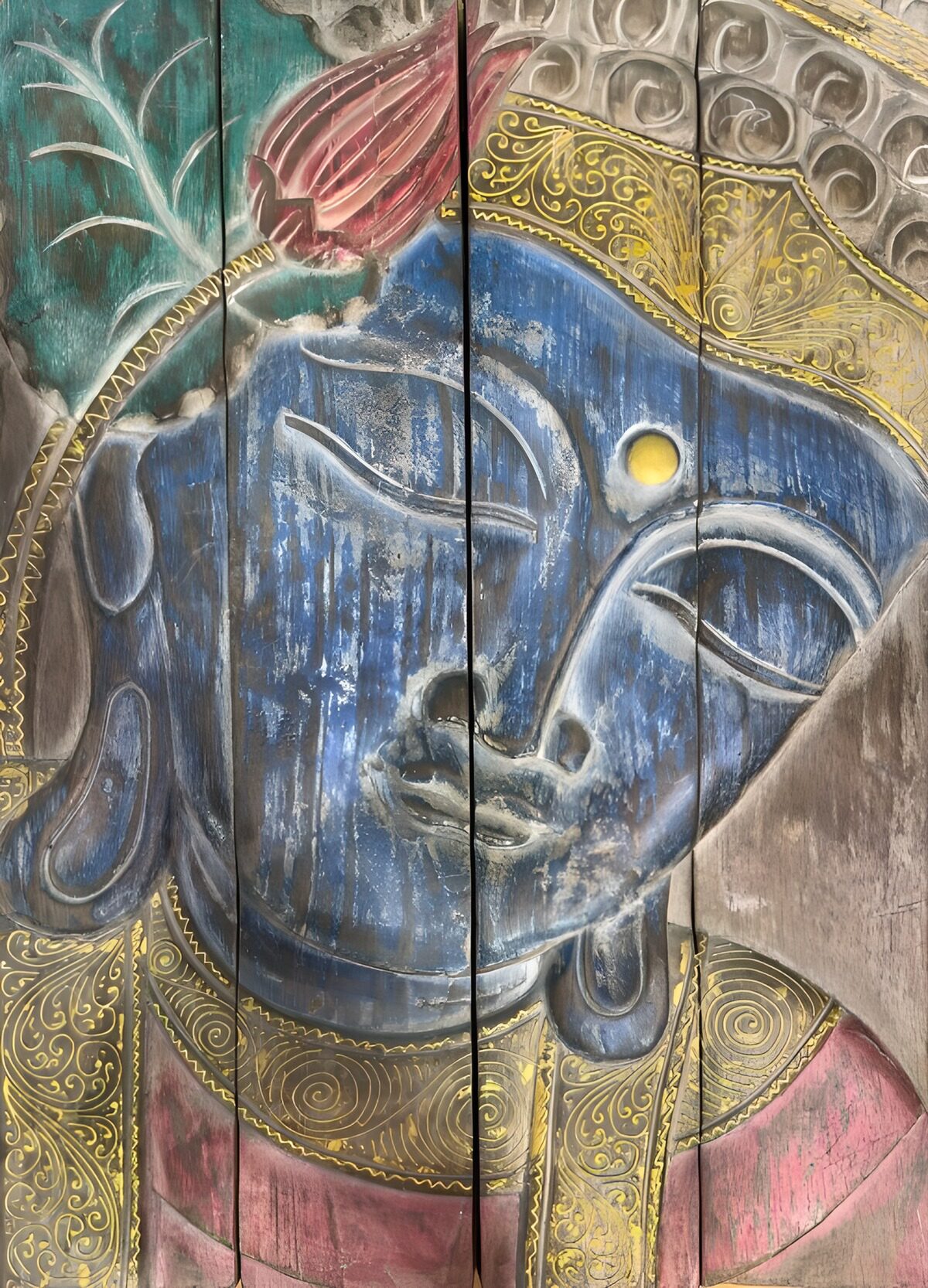 Blue Buddha on weathered wood