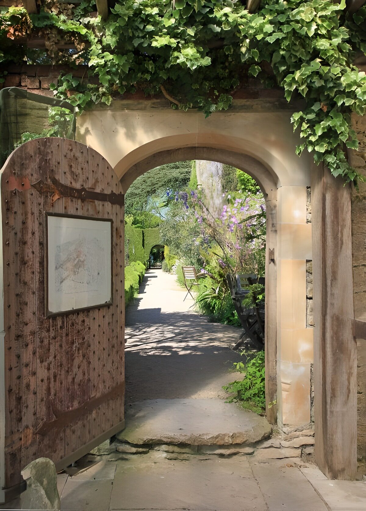 A stone arch where the garden beckons