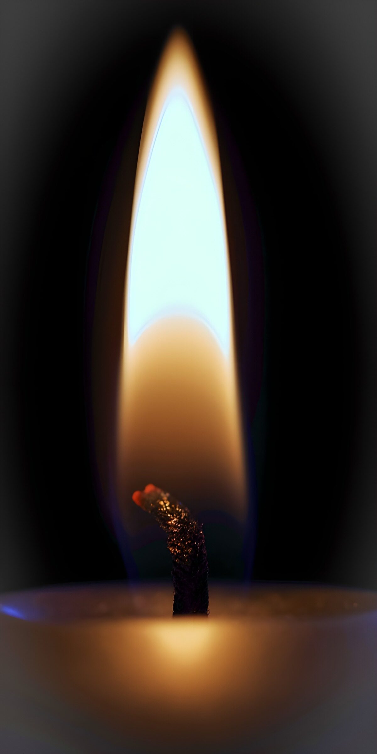 Candle flame in the quiet dark