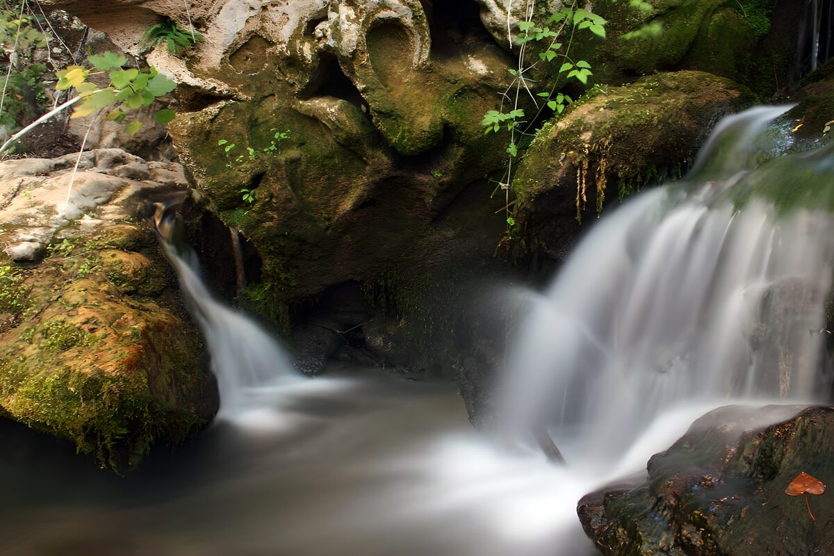 Soft waterfall over mossy rocks