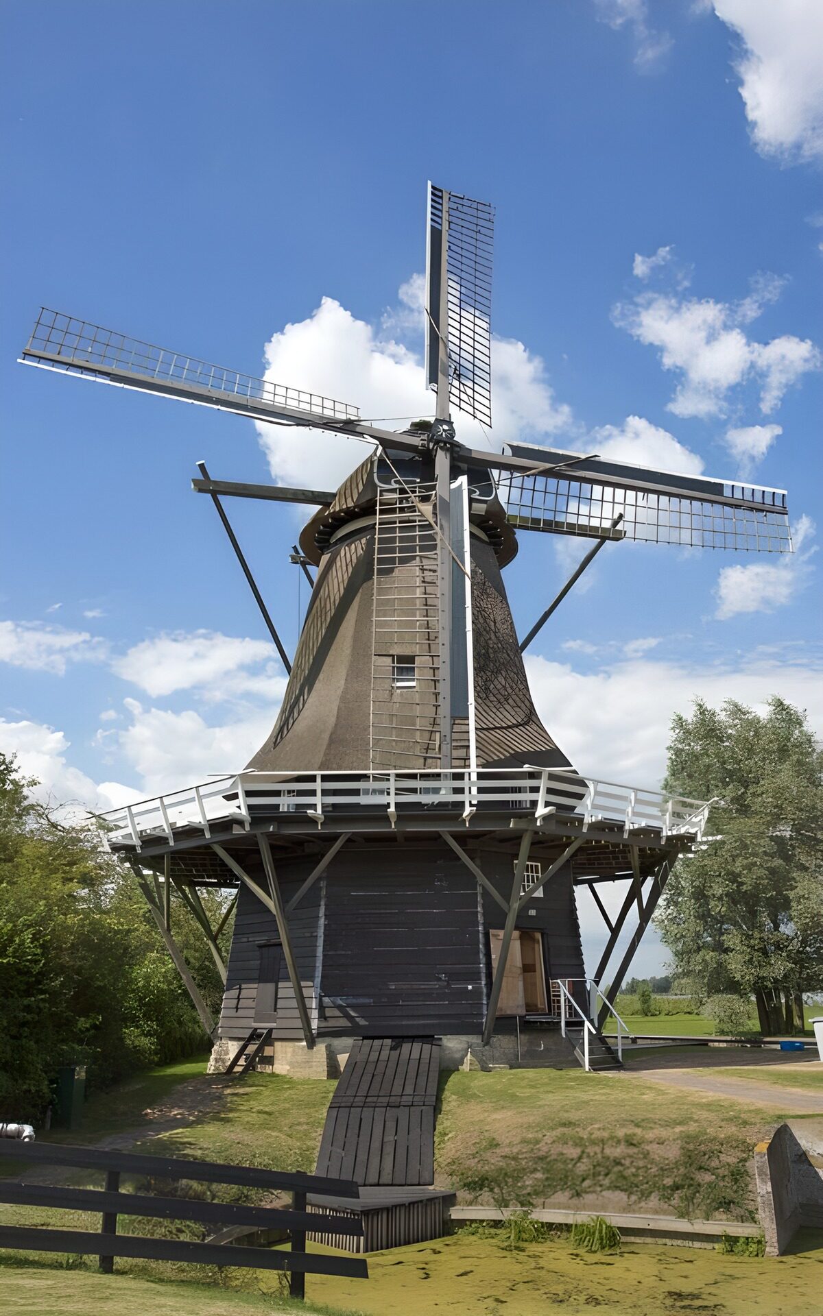 Sunlit windmill beneath a blue sky
