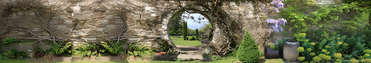 Round gateway in a leafy old stone wall