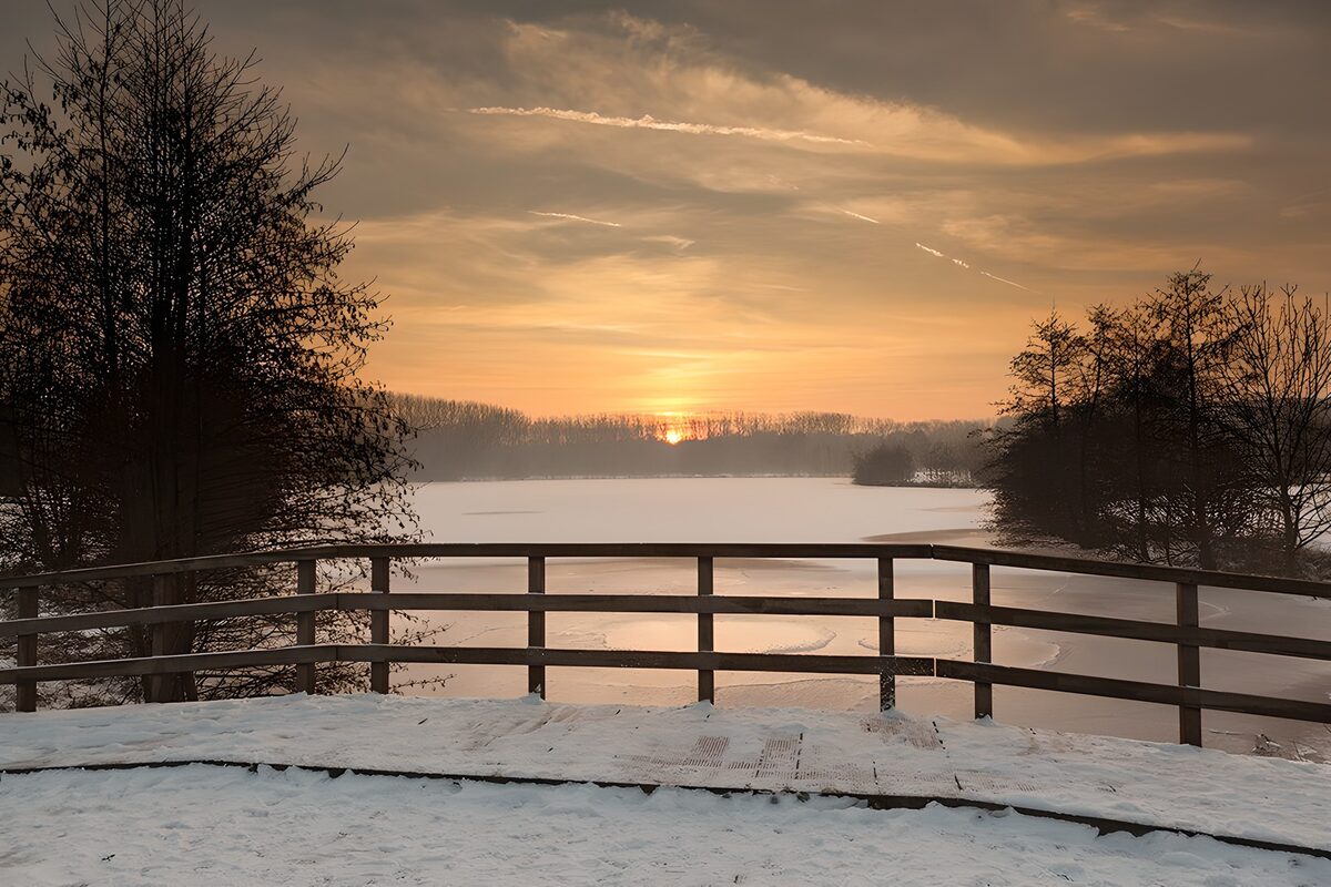 Sunset over a snow-covered lake