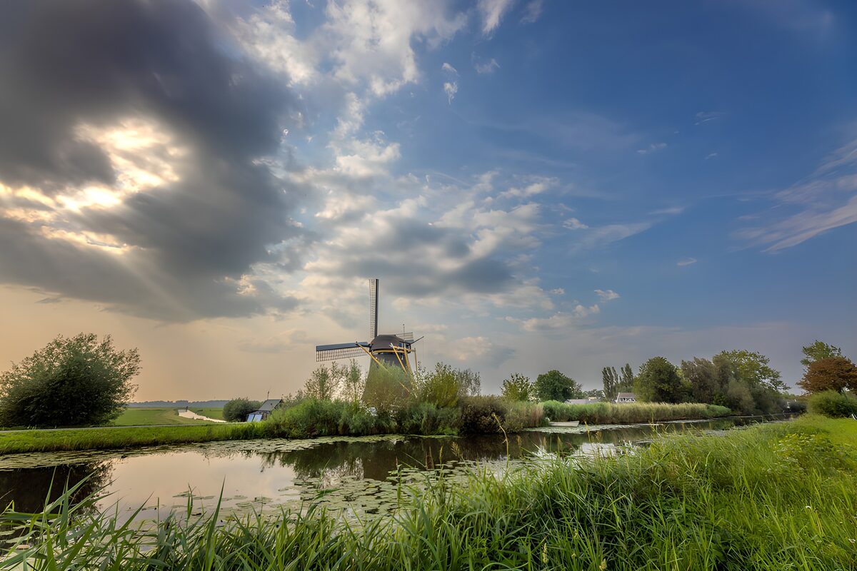 A windmill between shadow and sunlight