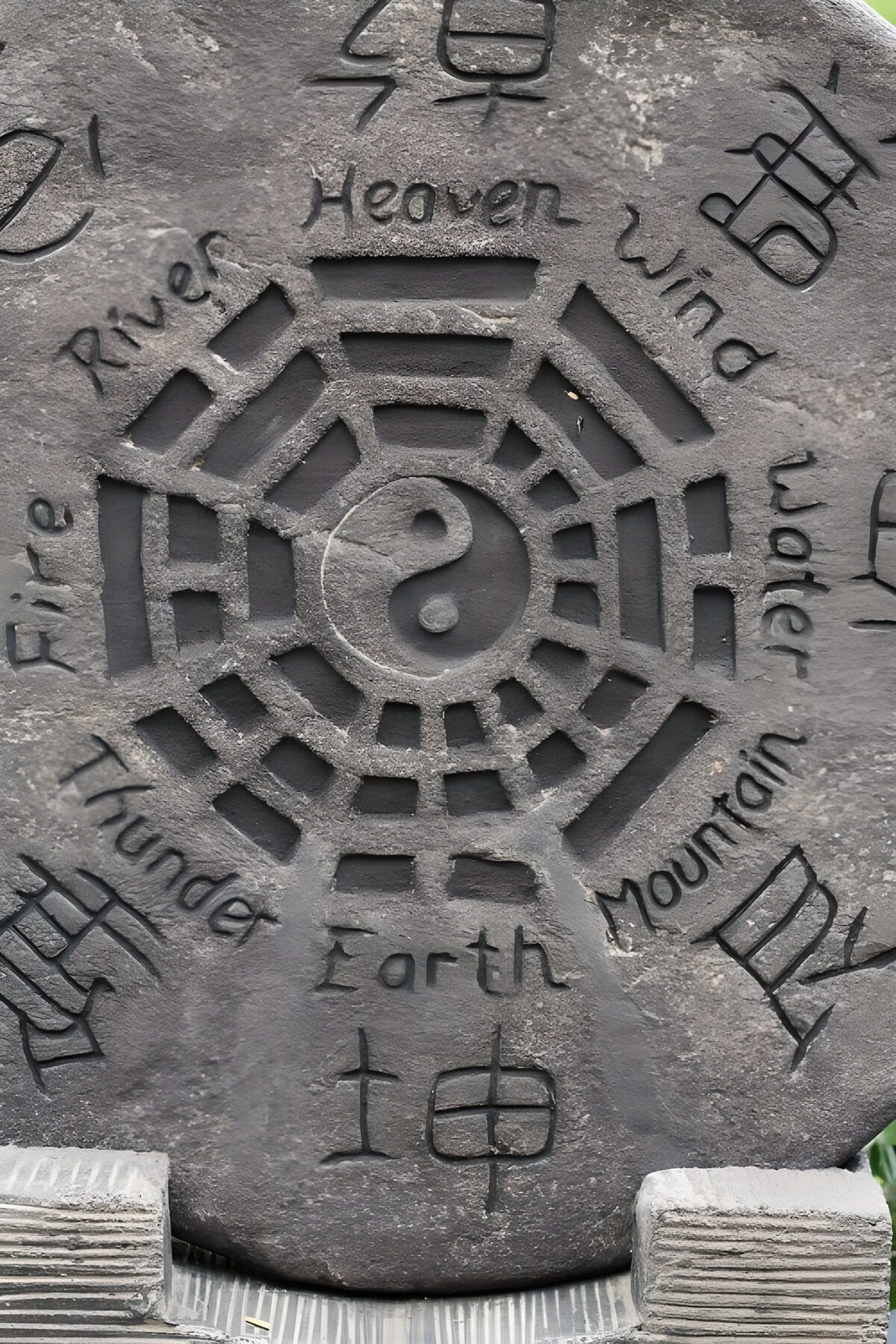 Weathered stone with a yin-yang carving